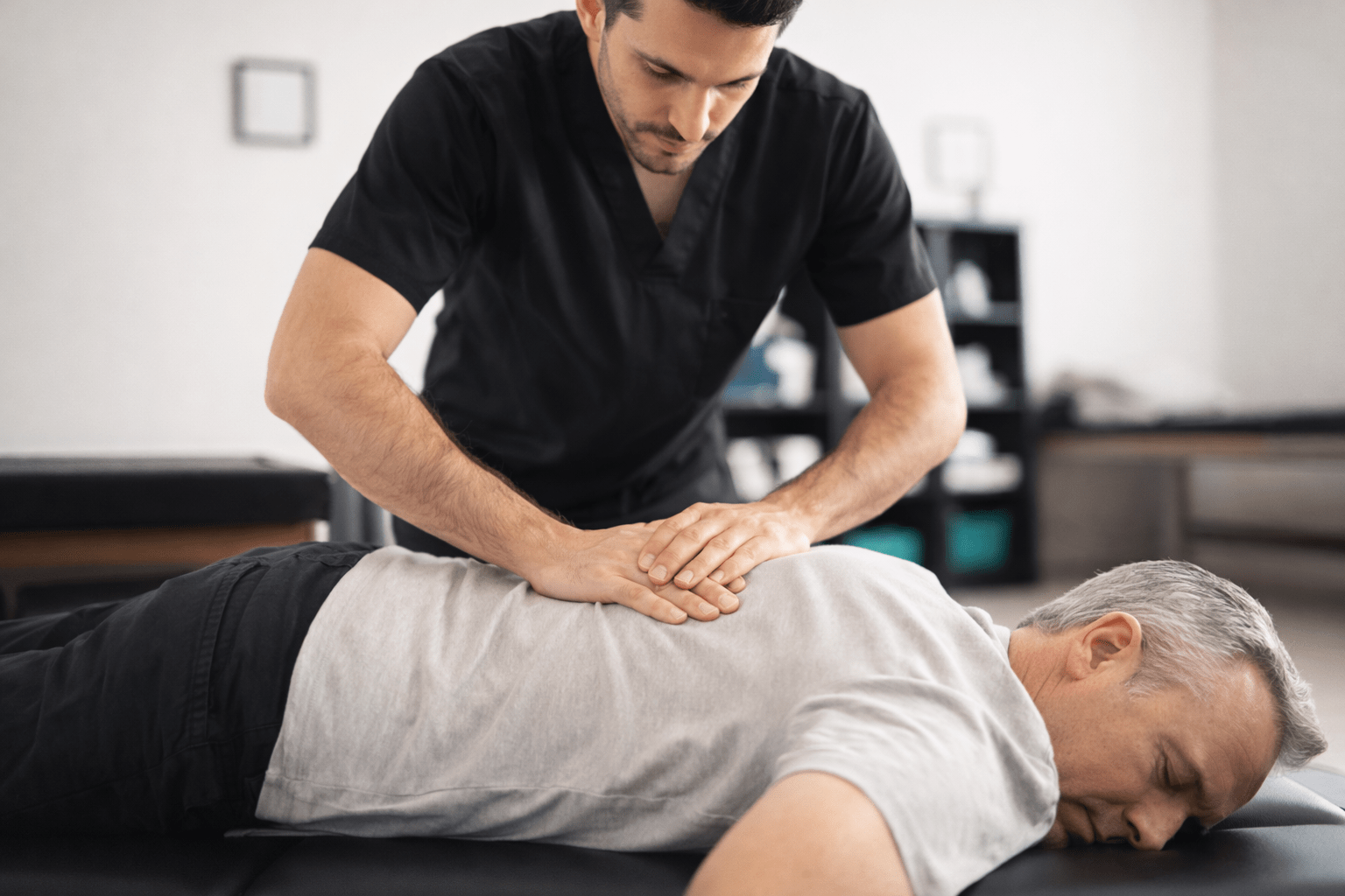 Chiropractor performing deep tissue manual therapy