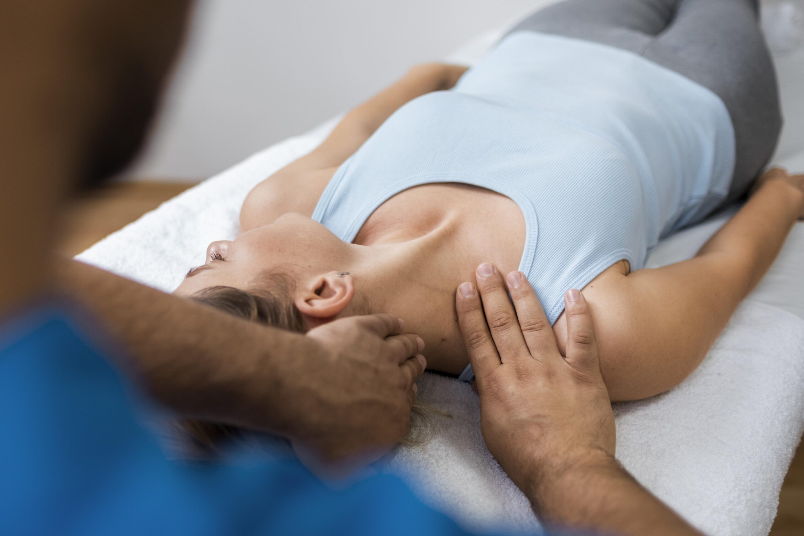 Chiropractor performing soft tissue manipulation on patient